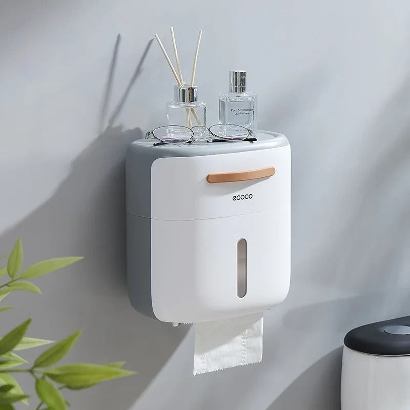 Multifunctional tissue dispenser with a sleek design and a spacious top tray for accessories or decorative items.