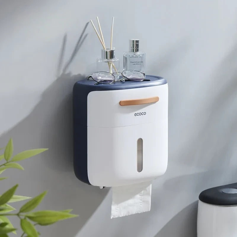 Chic wall-mounted gray tissue dispenser featuring a sleek tissue slot and a storage tray for bathroom essentials.