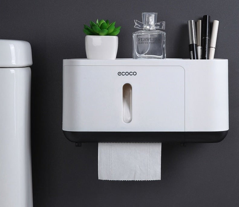 Modern Ecoco toilet paper dispenser with a built-in top shelf for storing toiletries and small essentials.


