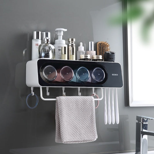 Wall-mounted multi-functional kitchen storage rack with four integrated cups, a top shelf for toiletries or kitchen essentials, hanging hooks for towels and accessories, and a sleek modern design.